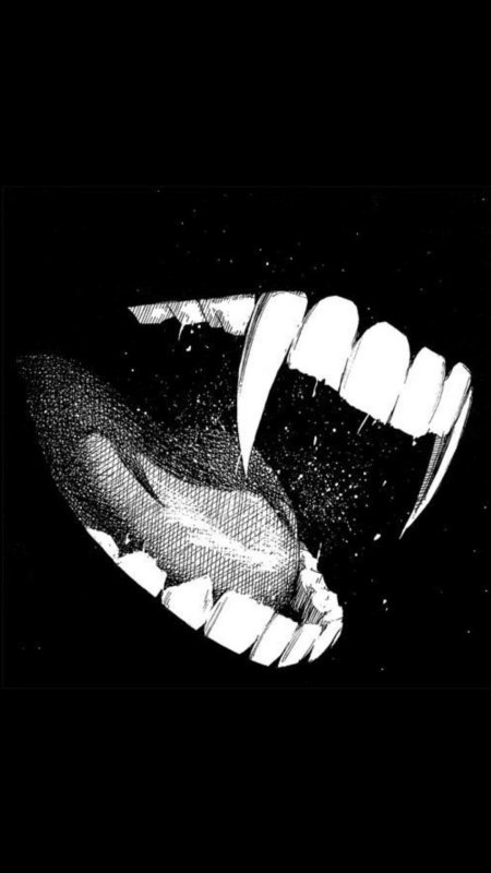 Клыки на черном фоне