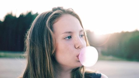 Blowing bubble gum