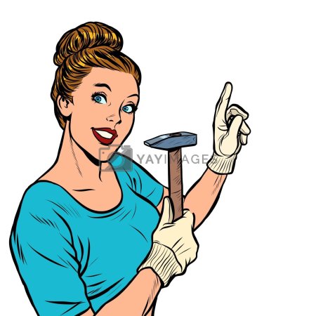 Женщина забивает гвоздь