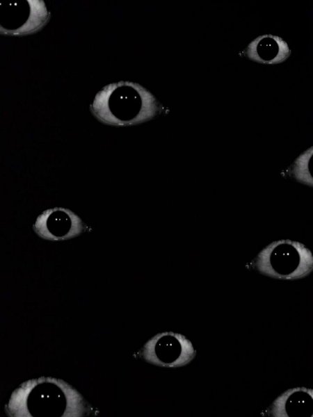 Много глаз на черном фоне