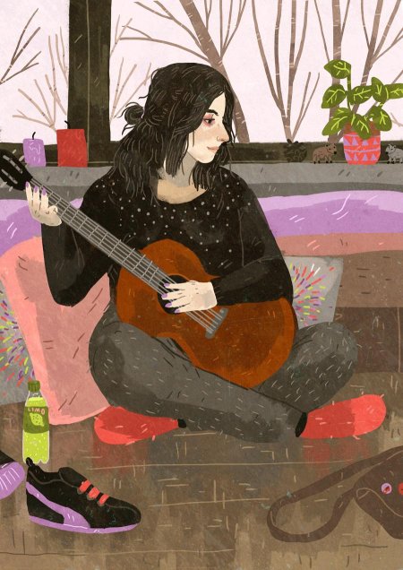 Девушка играет на гитаре