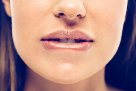 Закусывание губы