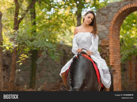 Beautiful young woman in Medieval Dress with a Horse Outdoor - stock photo
