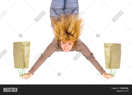 A man carrying a Bag upside down