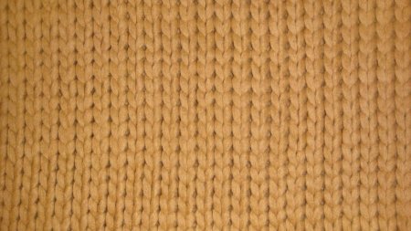 Бежевая вязаная ткань