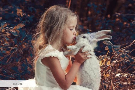 Девочка с кроликом в руках